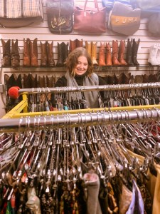 second hand, thrift store shopping. flipping through the racks of secondhand clothing, shoes, boots, and other vintage items.