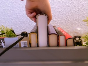 book sliding off a shelf, library loans