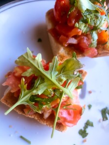 tomatoes arugula on bread for a delicious vegetarian snack